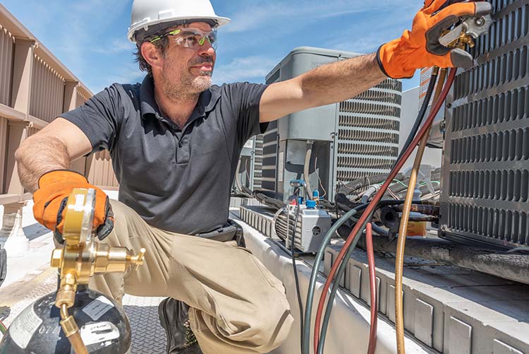 Hvac,Tech,Working,On,Installing,A,New,Condensing,Unit,On